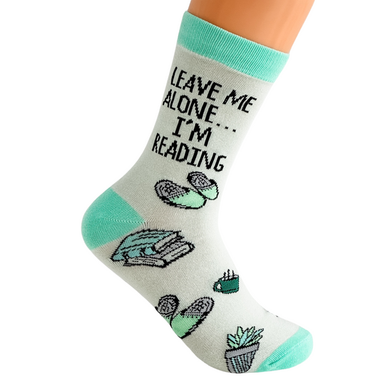 a pair of socks that say leave me alone i'm reading