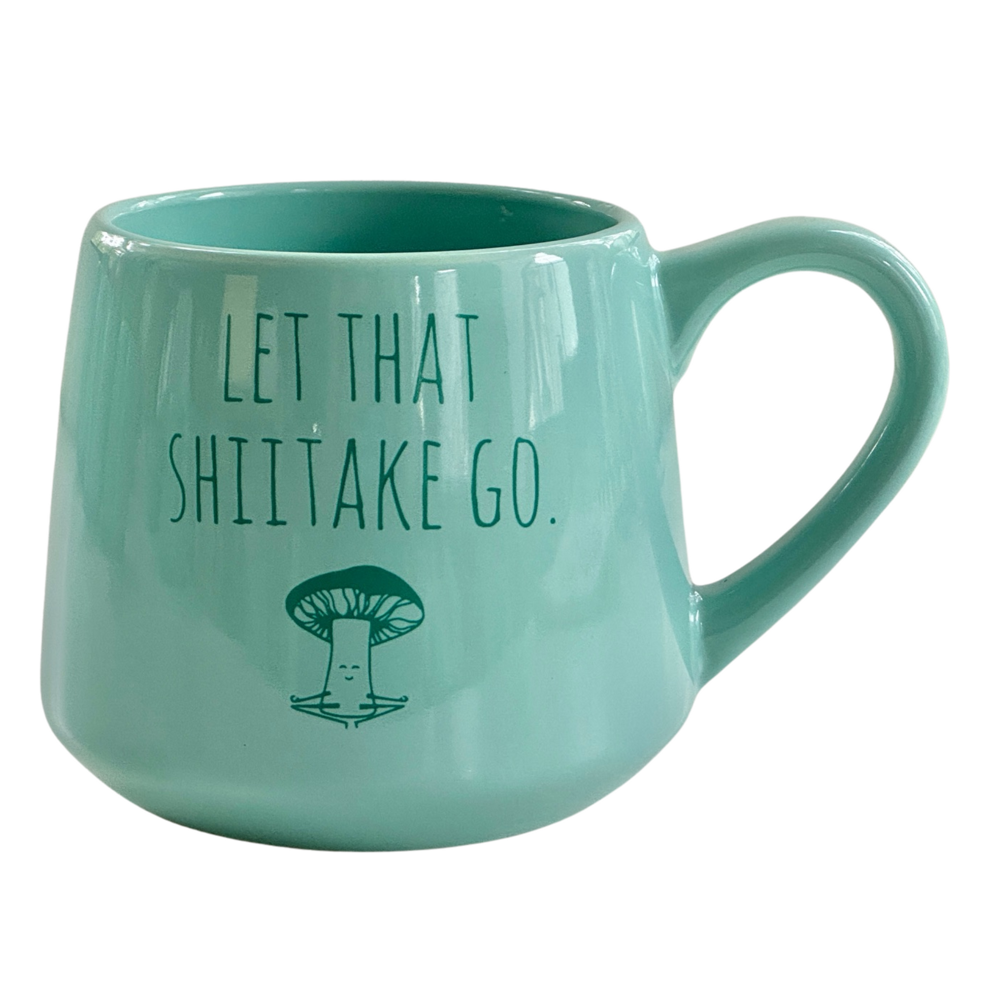 a green coffee mug with a mushroom on it