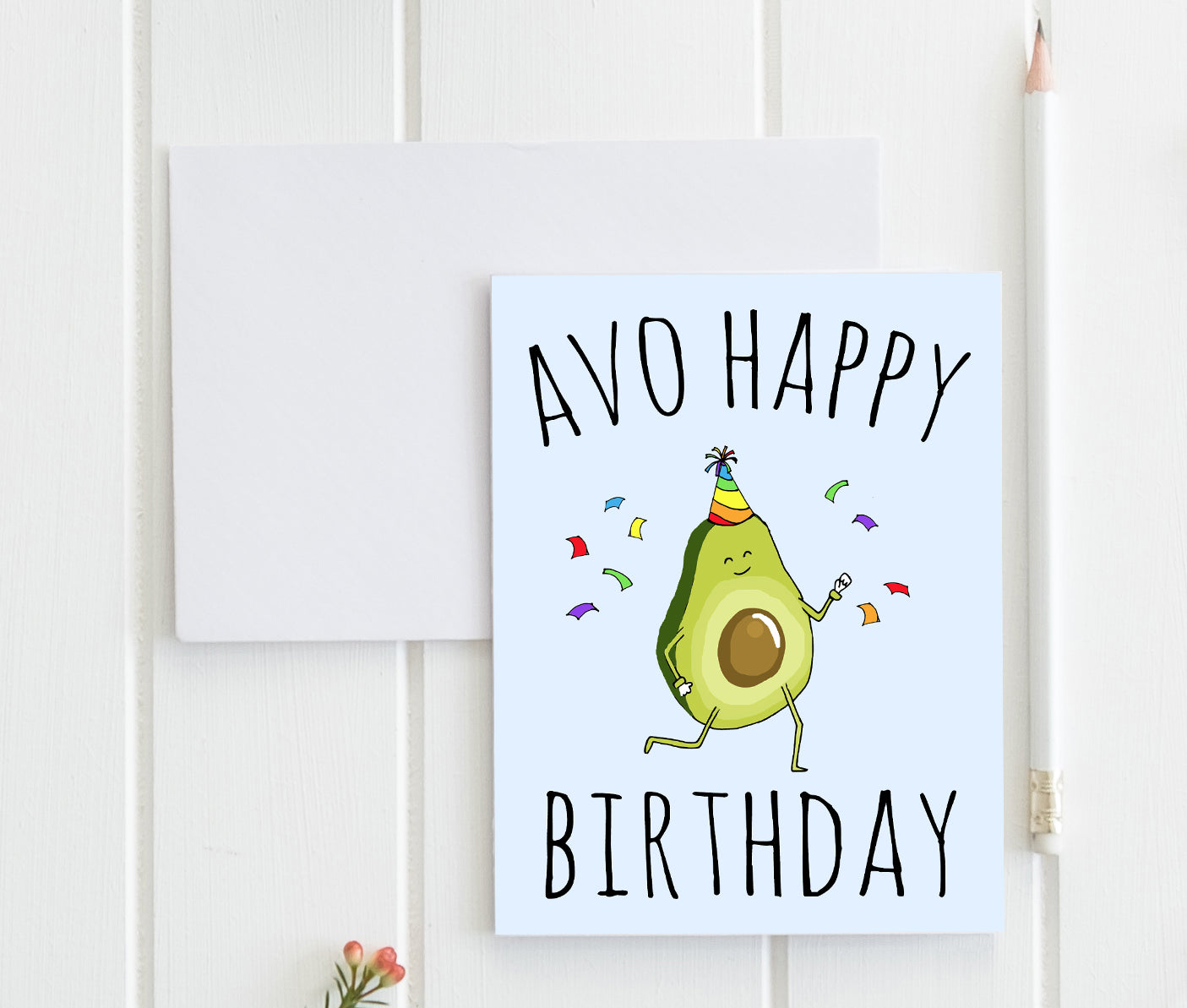 a birthday card with an avocado wearing a party hat