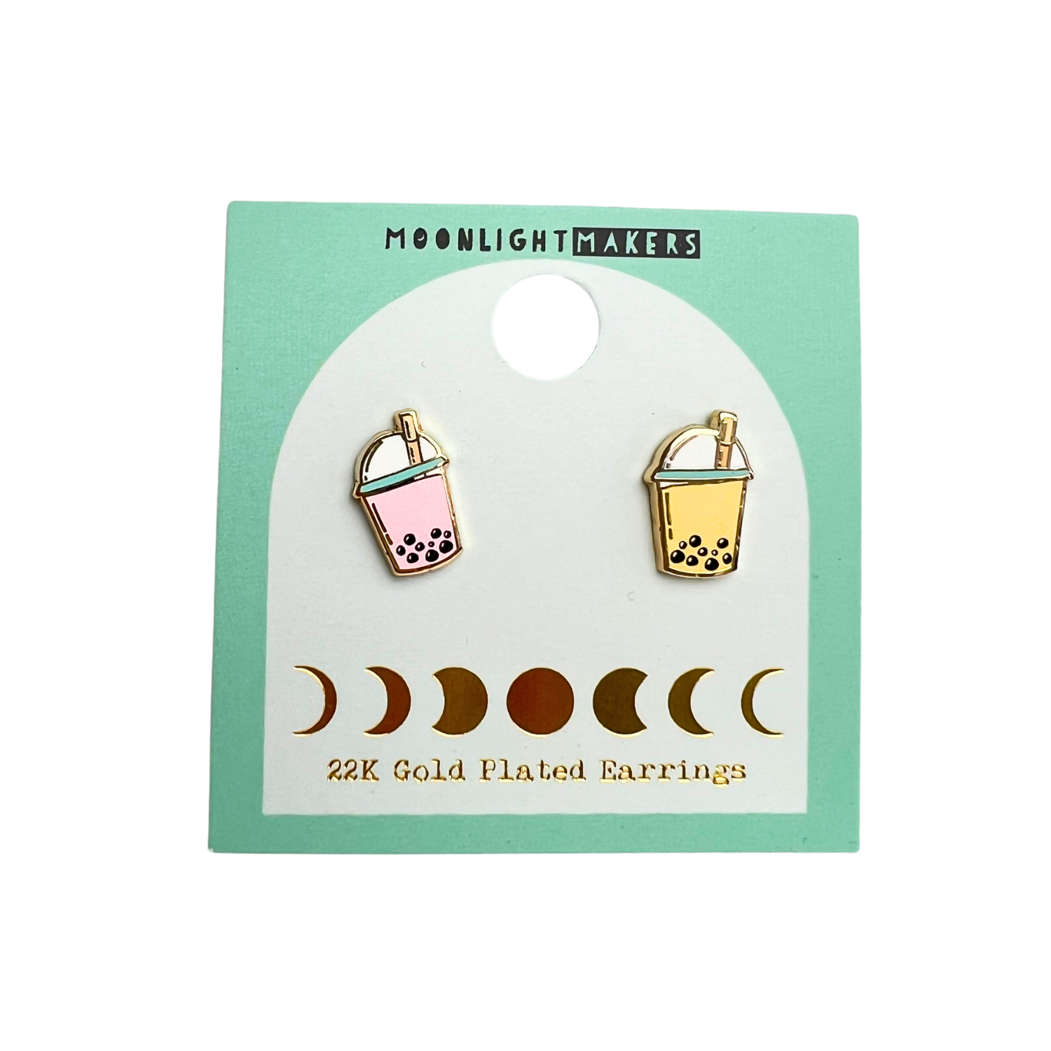 a pair of earrings with the moon and basket on them
