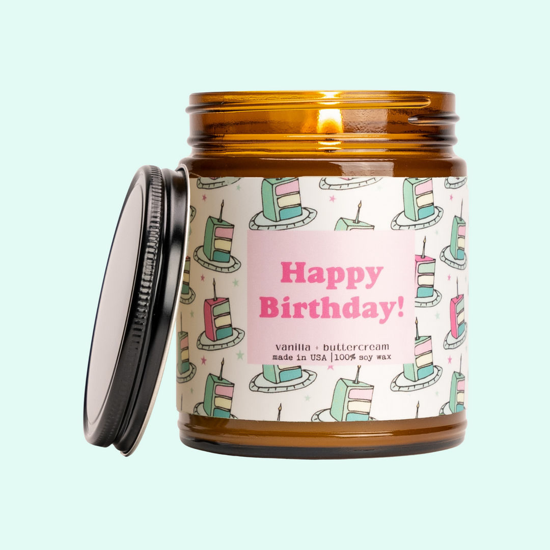 a jar of birthday candles sitting on a table