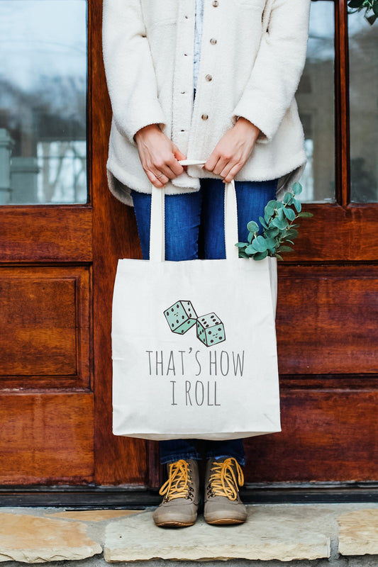 a woman holding a bag that says that show i roll