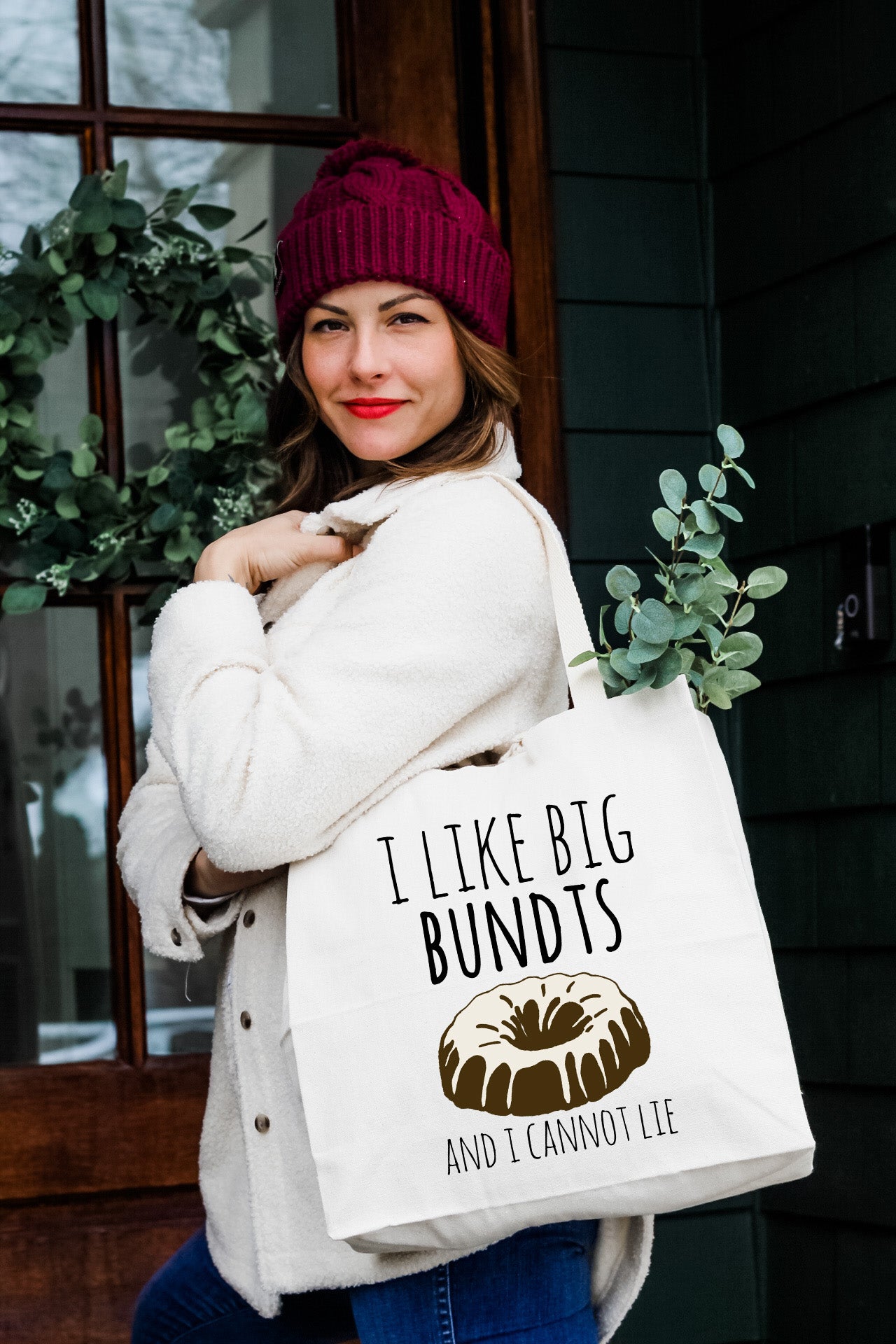 a woman carrying a bag that says i like big bundts and cannot lie