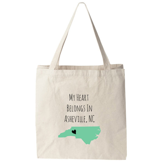 a tote bag with the words, my heart belongs in ashsville nc