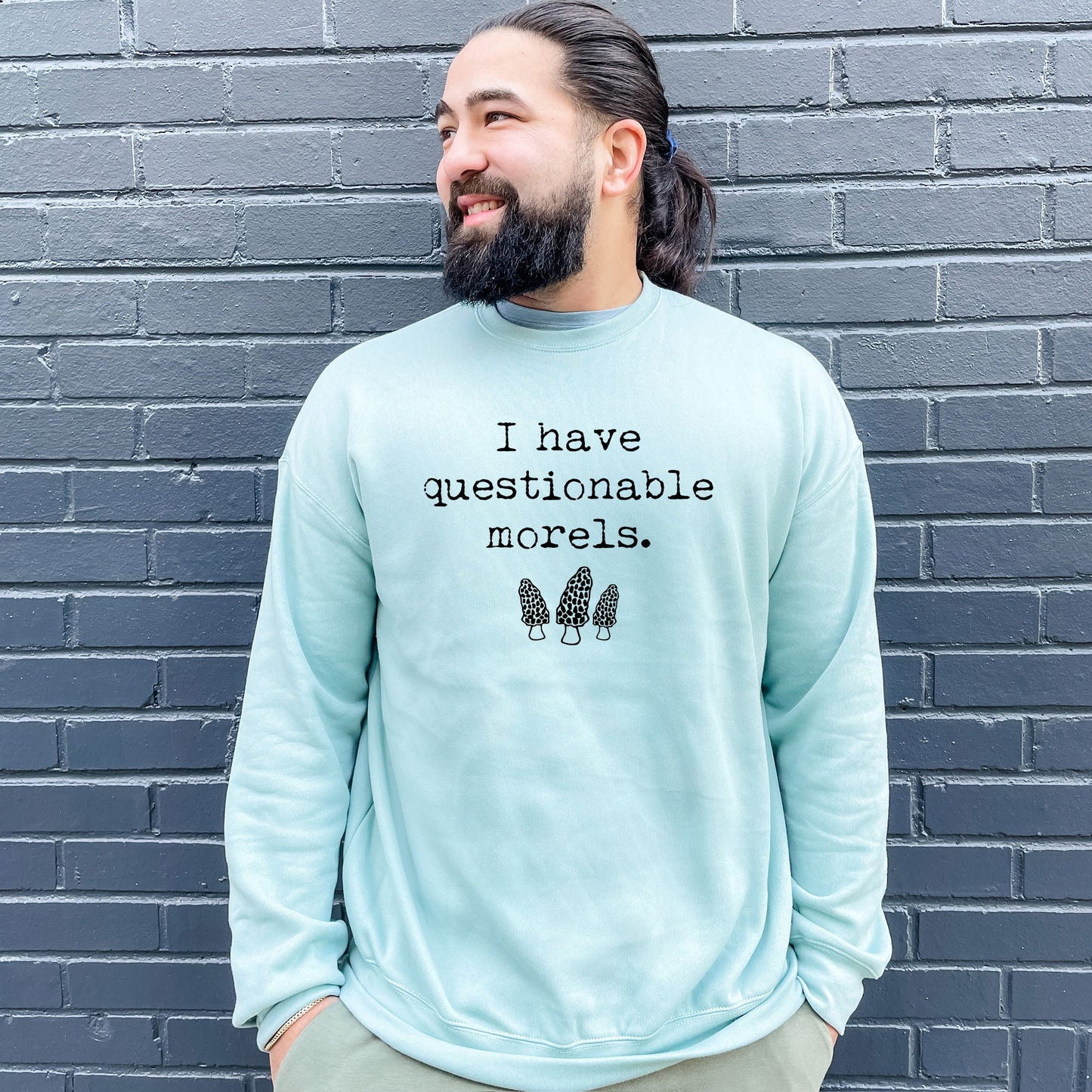 a man with a beard wearing a sweatshirt that says i have questionable models