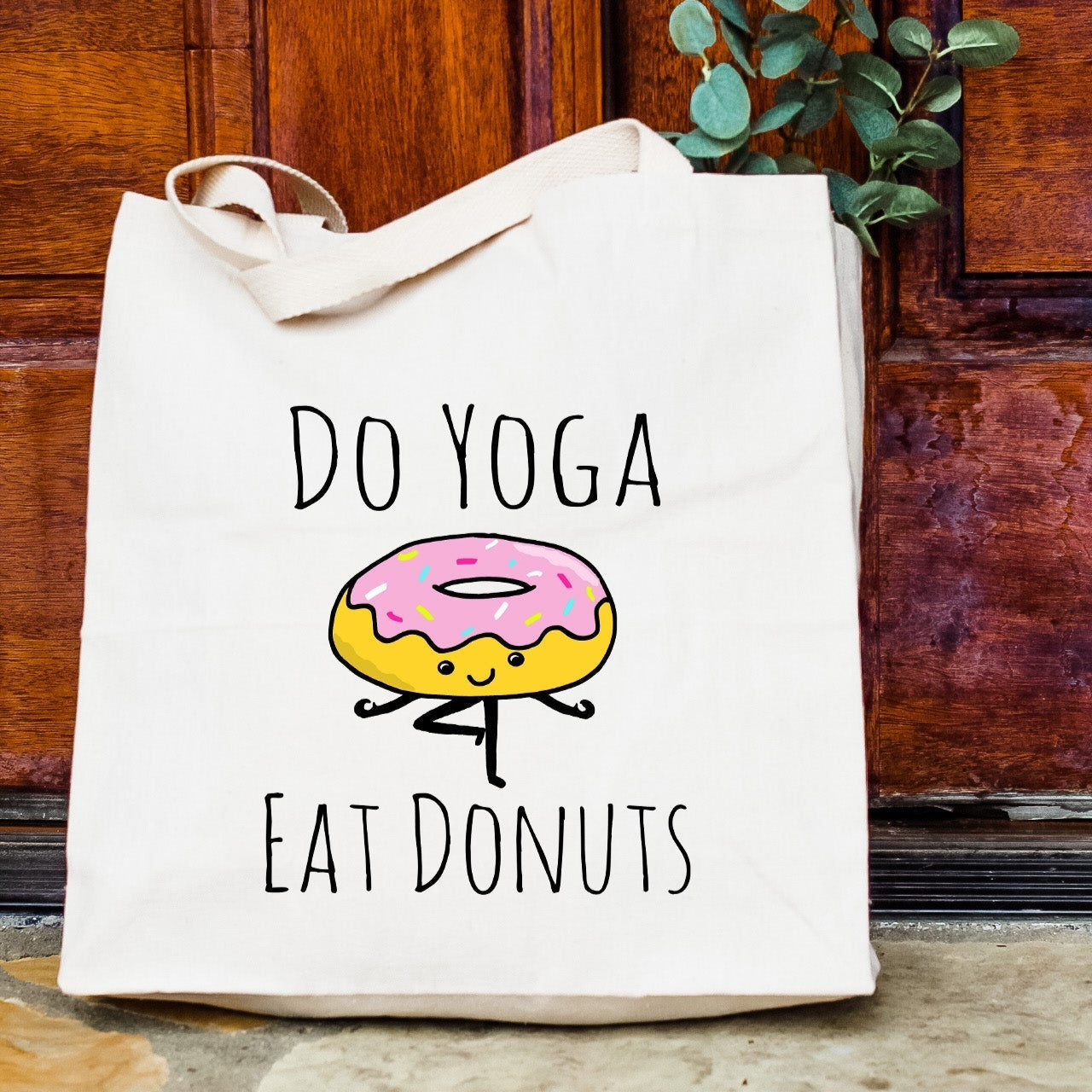 a tote bag with a donut printed on it