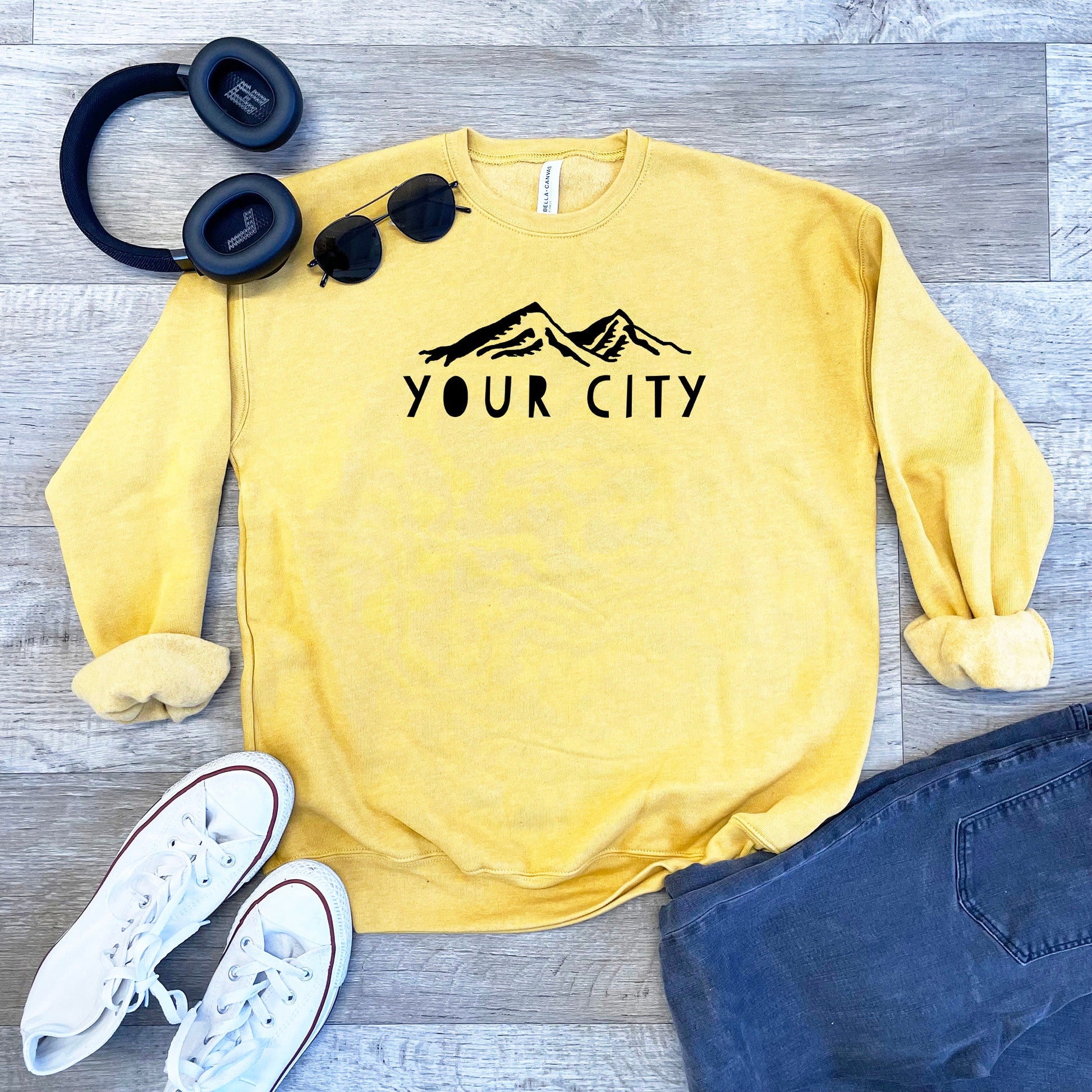 a yellow sweatshirt with the words your city on it