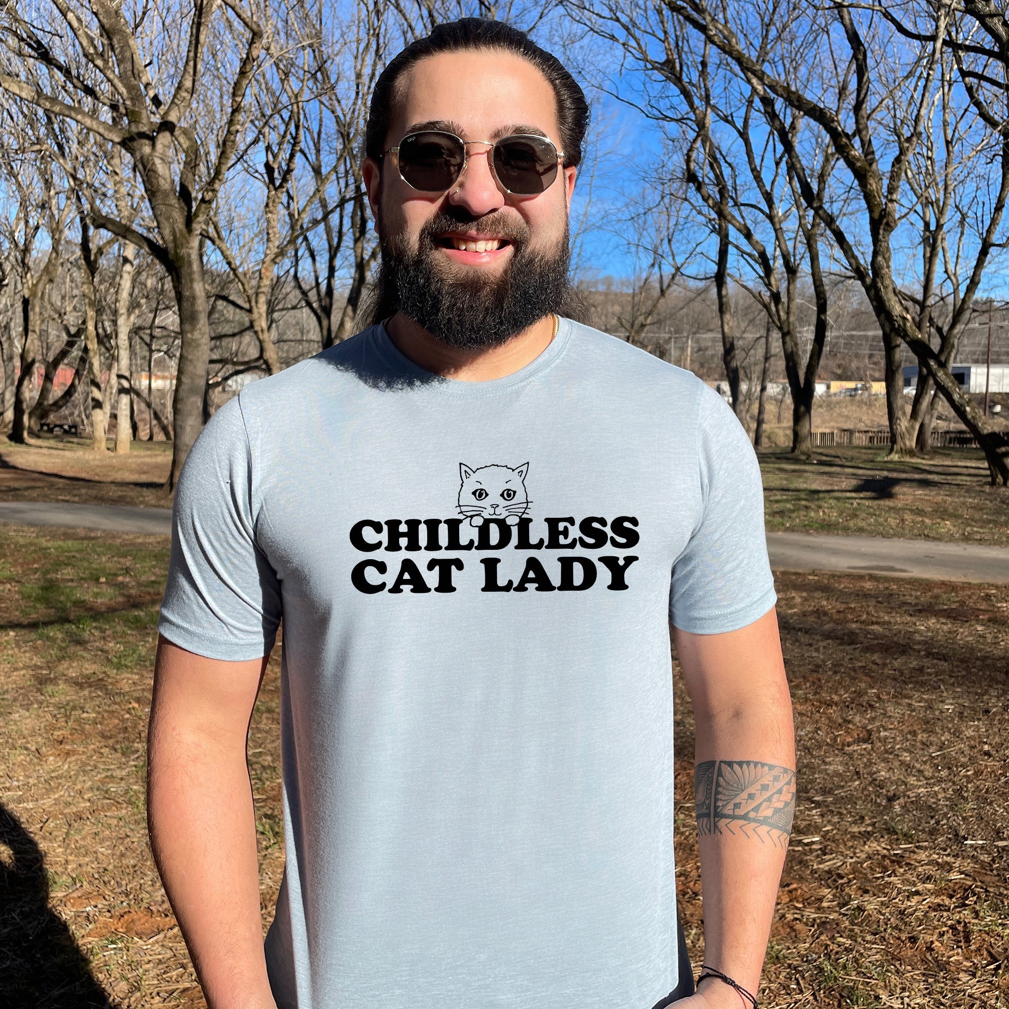 a man wearing a t - shirt with a cat on it