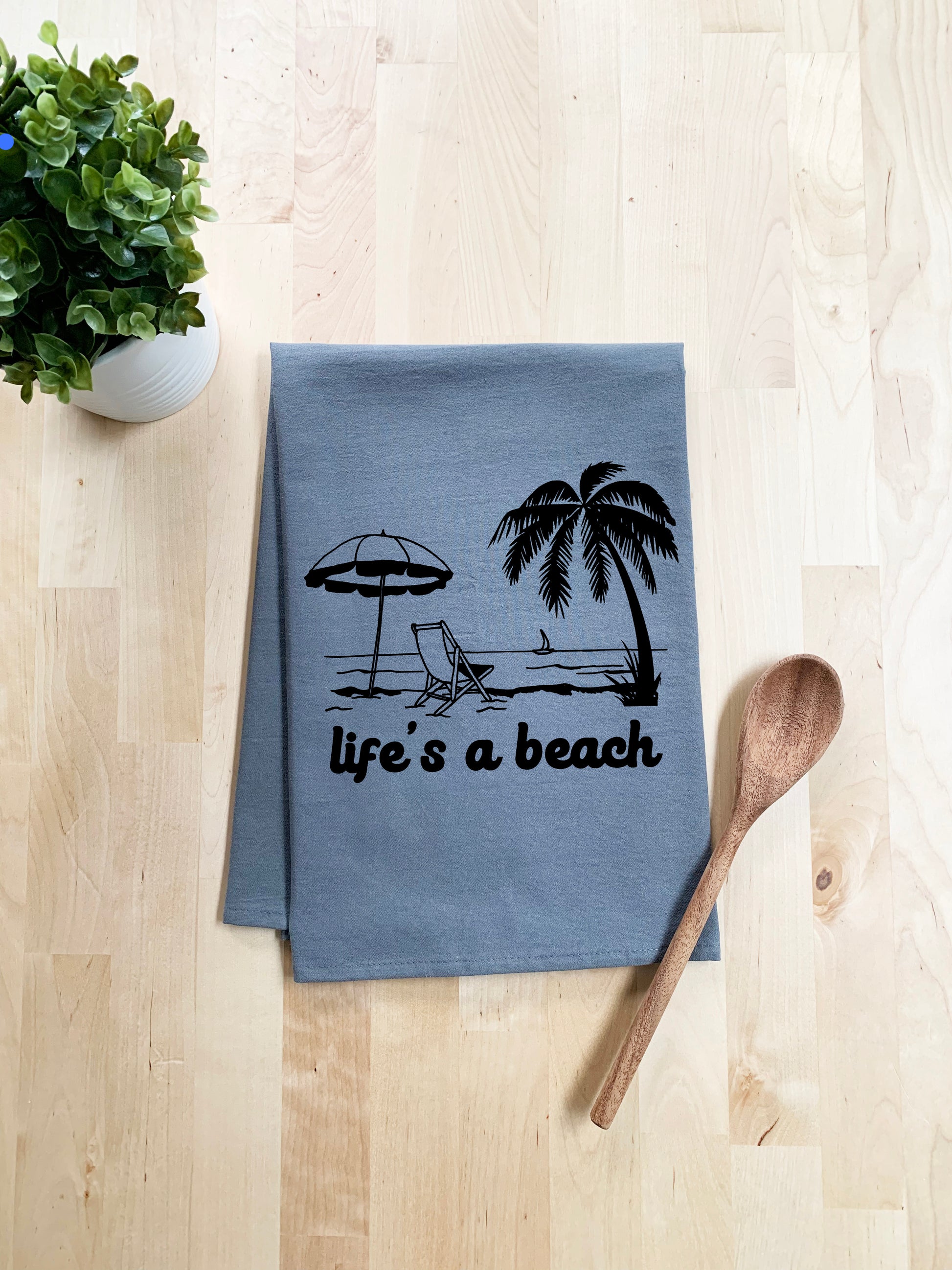 a tea towel with a beach scene on it