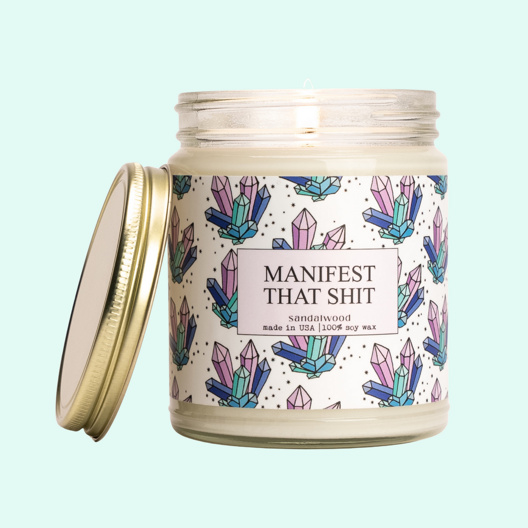 a jar of candles with a lid on a blue background