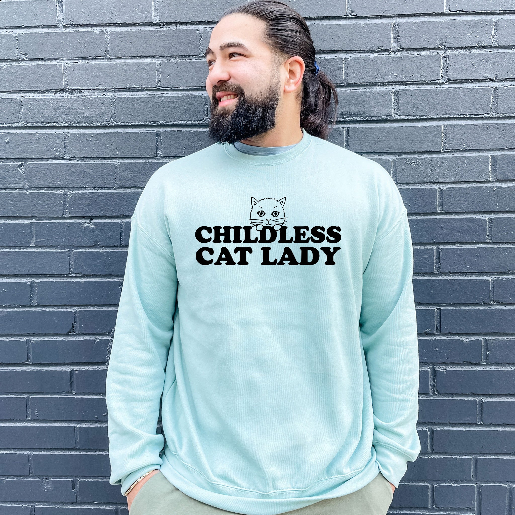 a man with a beard wearing a blue sweatshirt