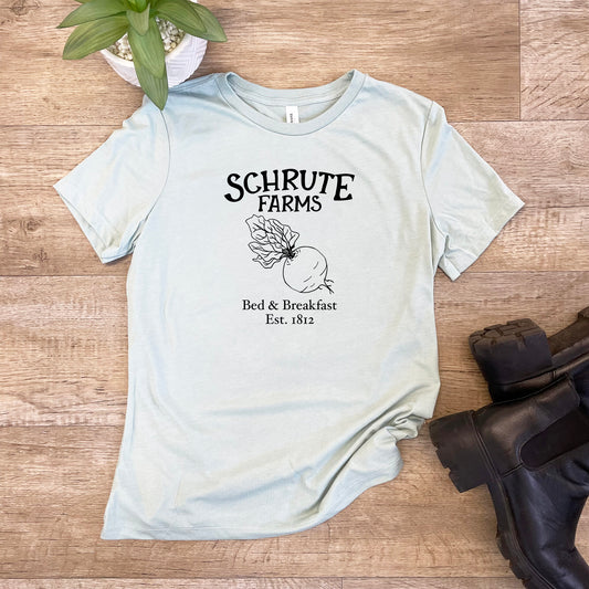 a t - shirt that says schrute farms with a picture of an apple