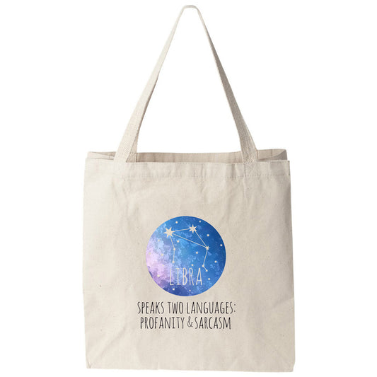 a tote bag with the words, speaks two languages, and a picture of