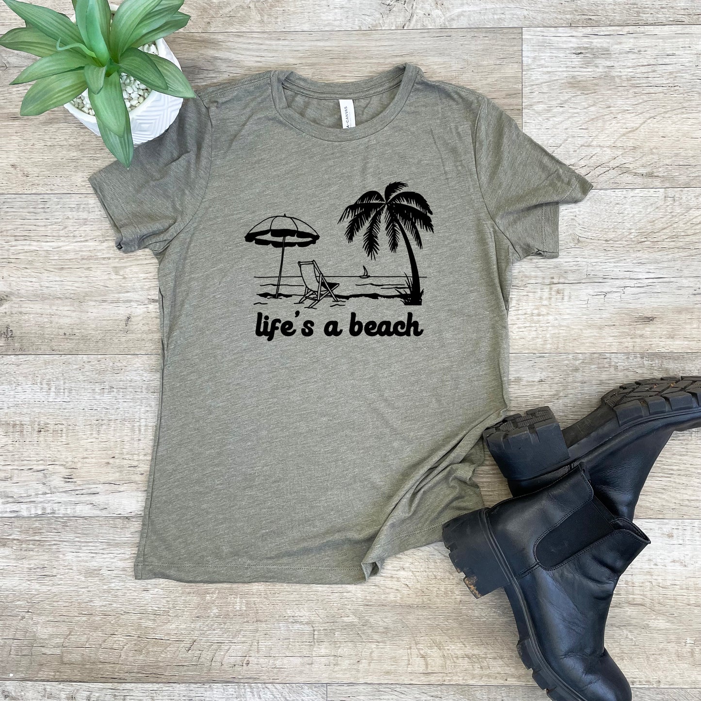 a t - shirt that says life's a beach with a palm tree and