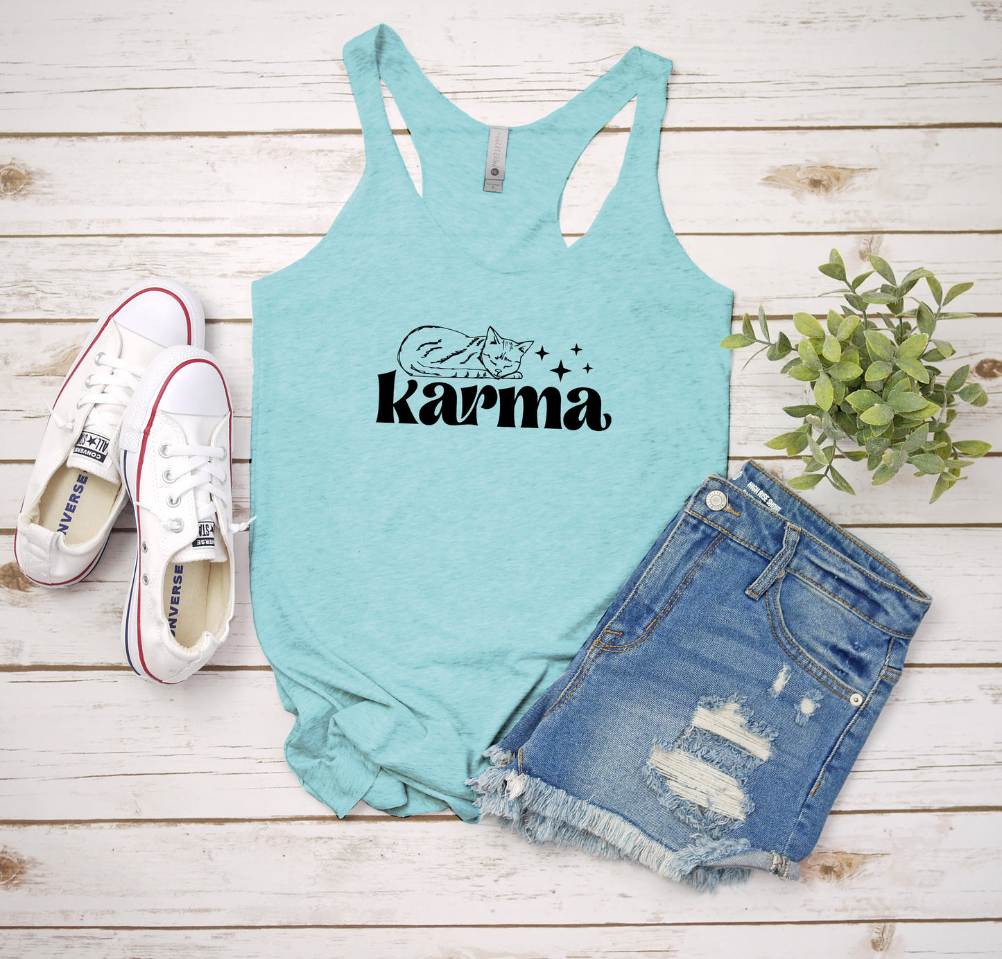 a women's tank top with the word karma printed on it