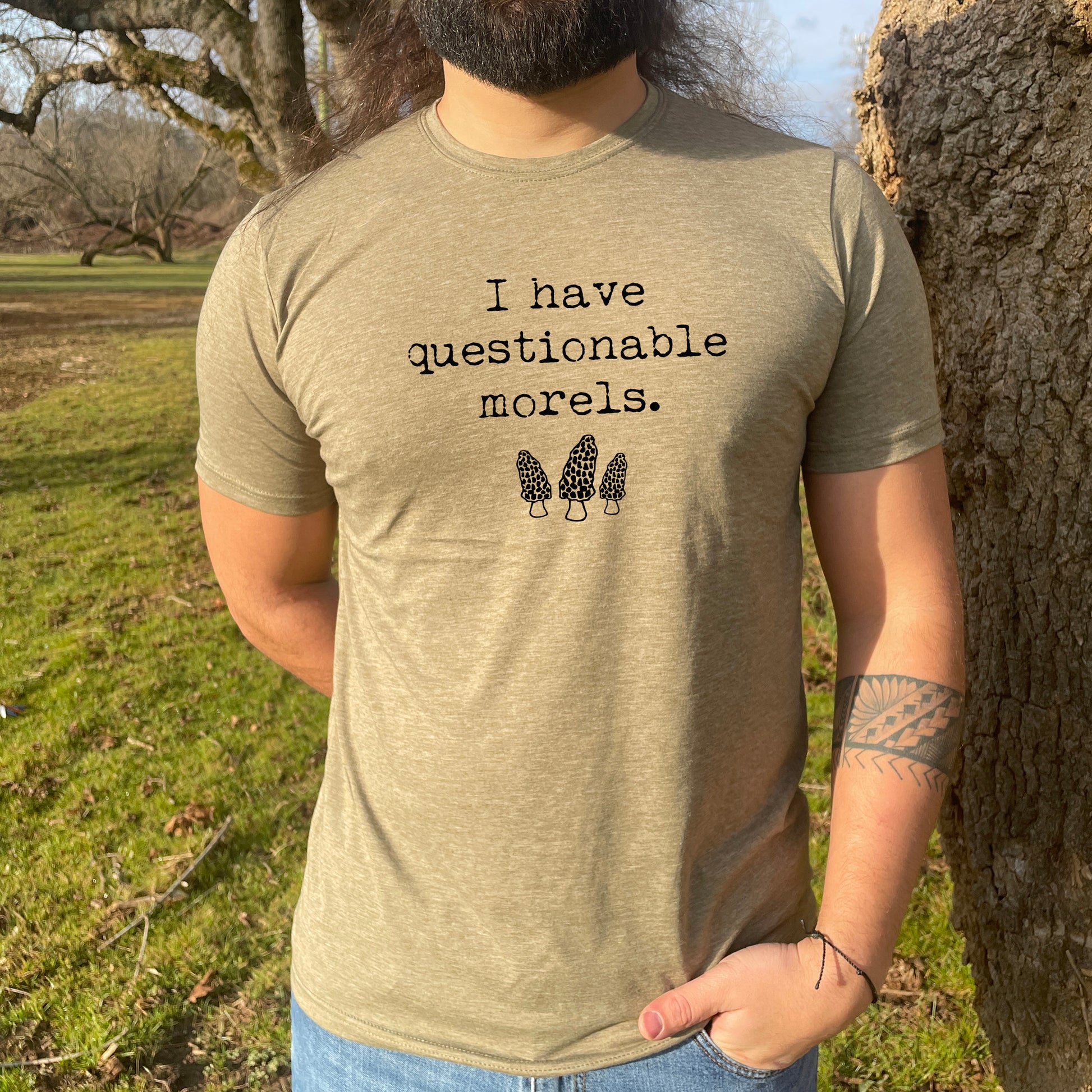 a man with a long beard wearing a t - shirt that says i have questionable