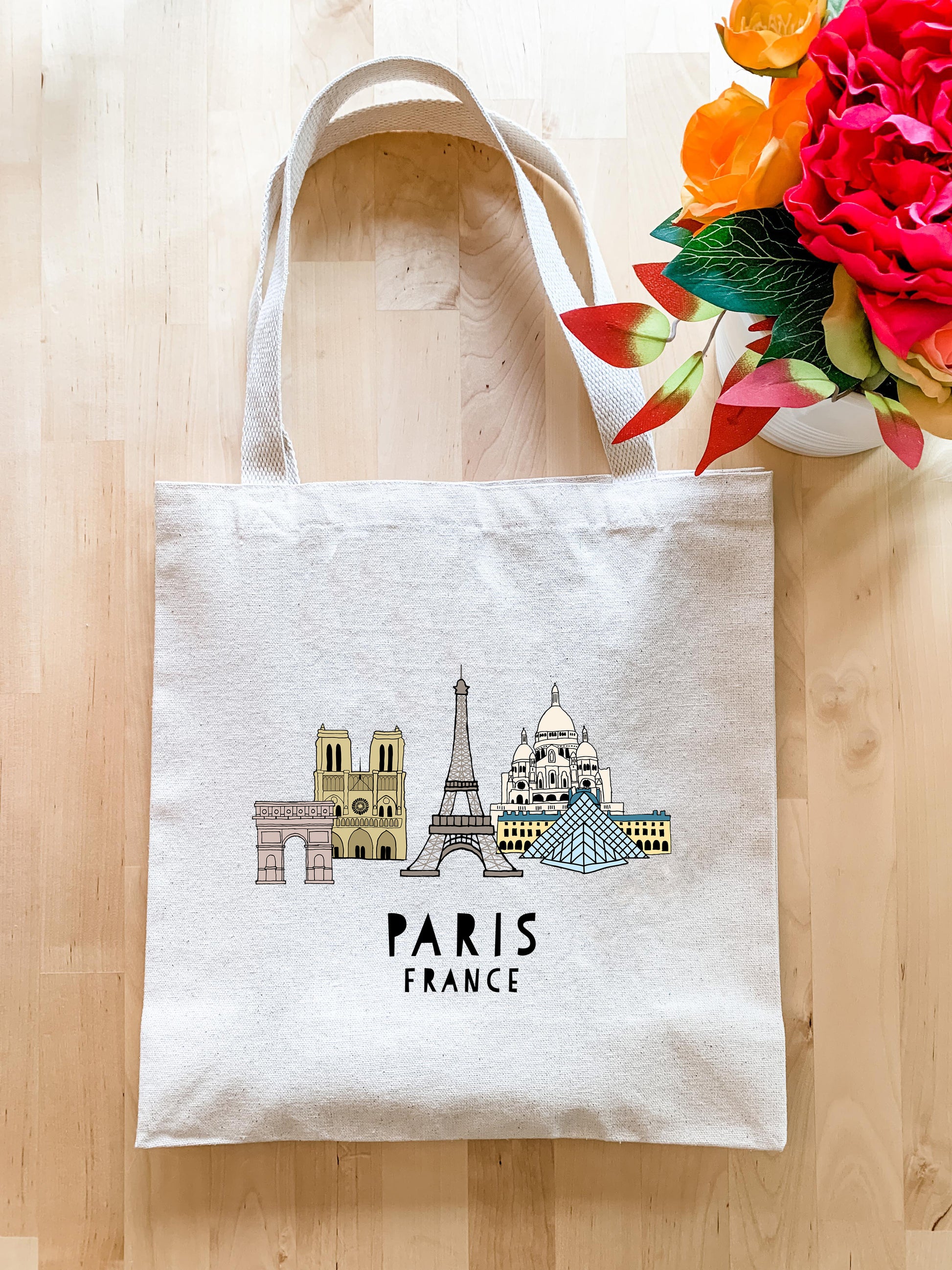 a white bag with a picture of the eiffel tower