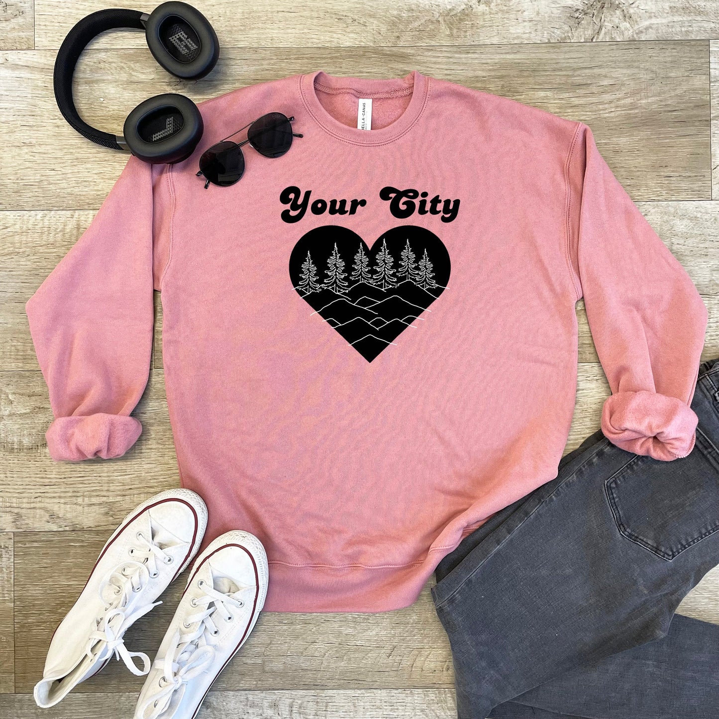 a pink sweatshirt with a heart and trees on it