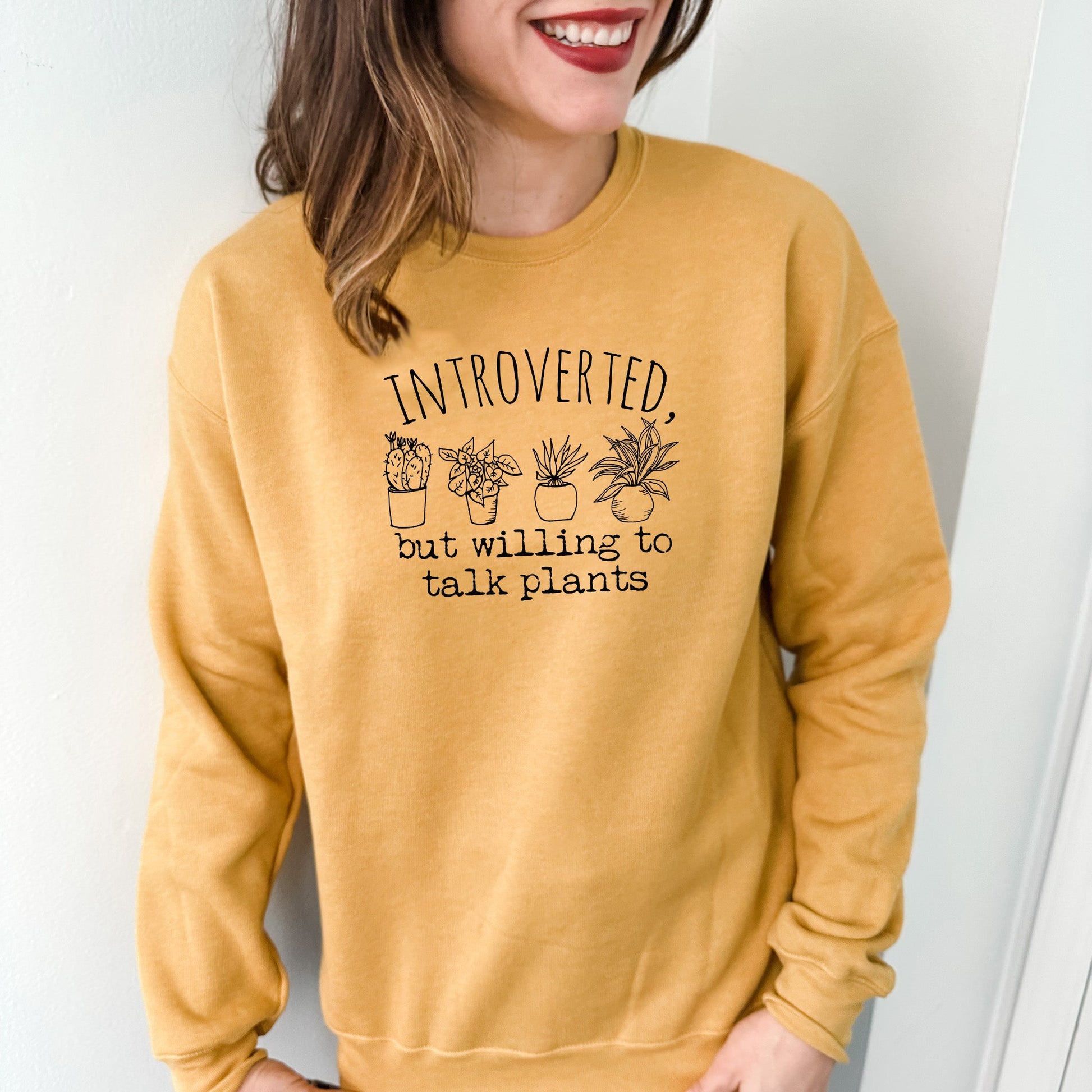 a woman wearing a sweatshirt that says, i'm introed but i '