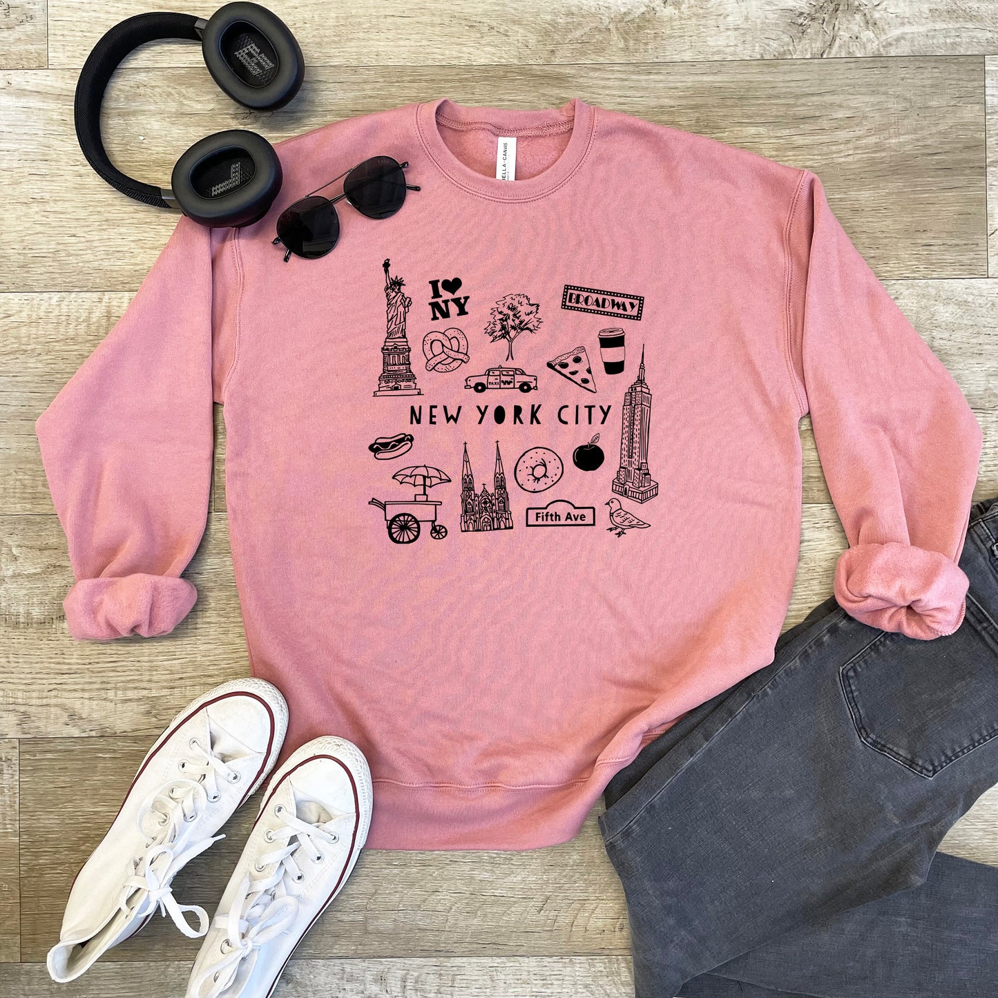 a pink sweatshirt with the words new york city printed on it