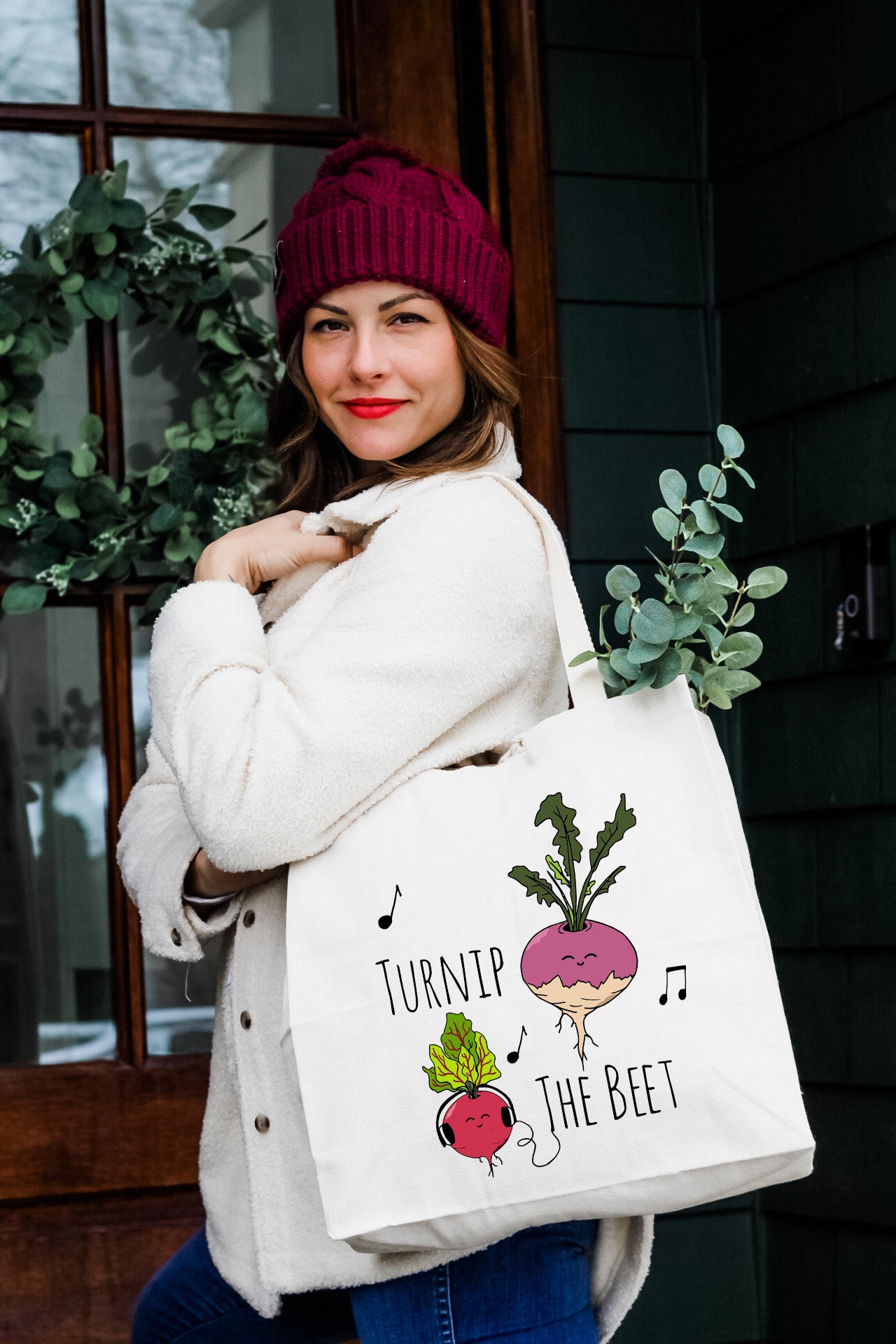 a woman carrying a bag that says turnip the beet