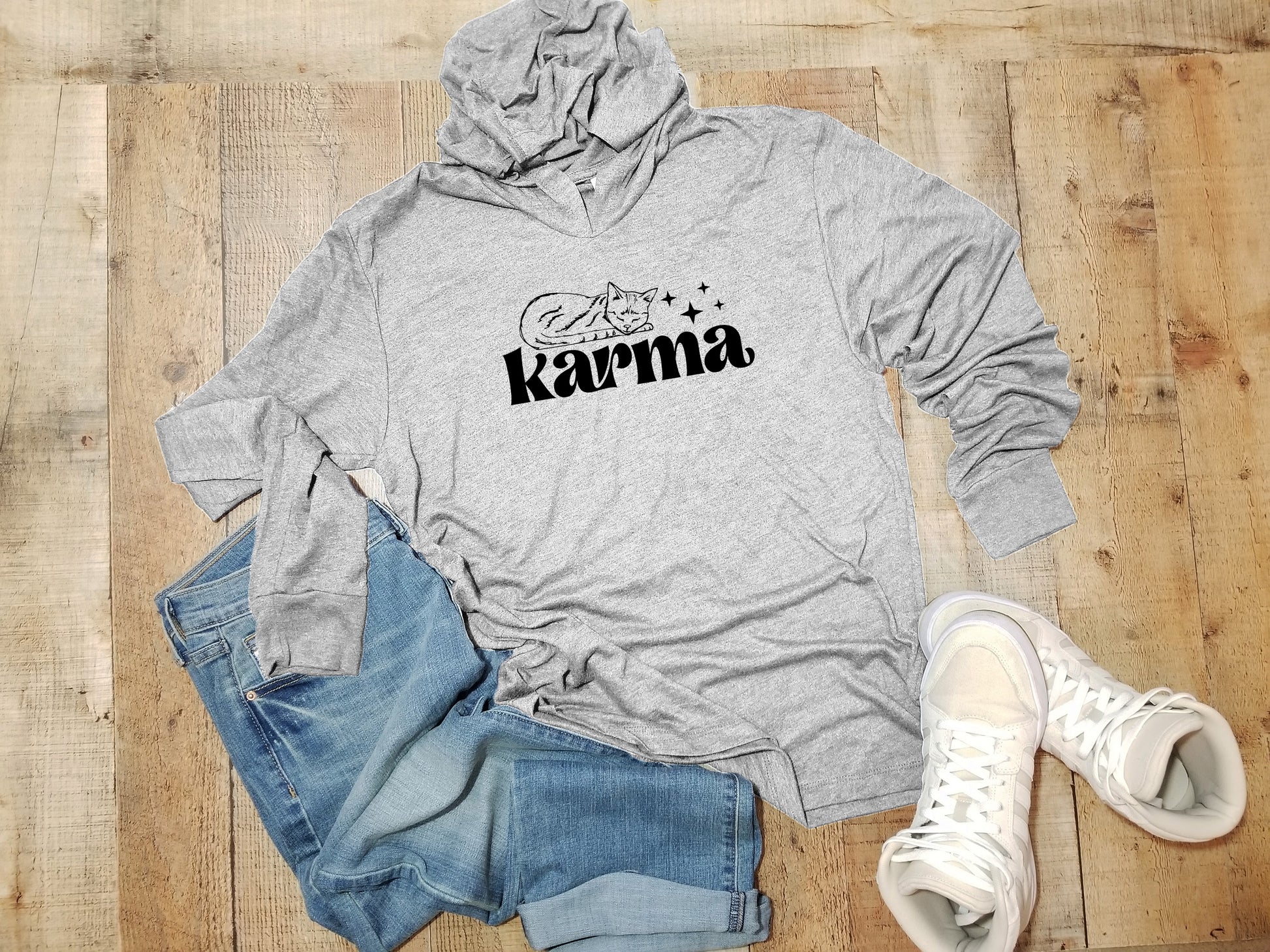 a gray hoodie with the word karma on it