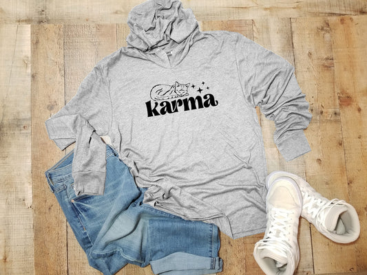 a gray hoodie with the word karma on it