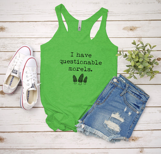 a green tank top that says i have questionable models next to a pair of