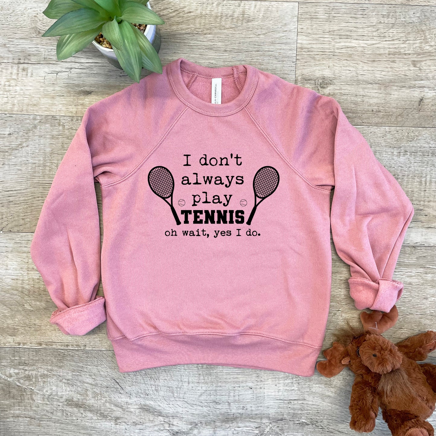 a pink sweatshirt that says i don't always play tennis