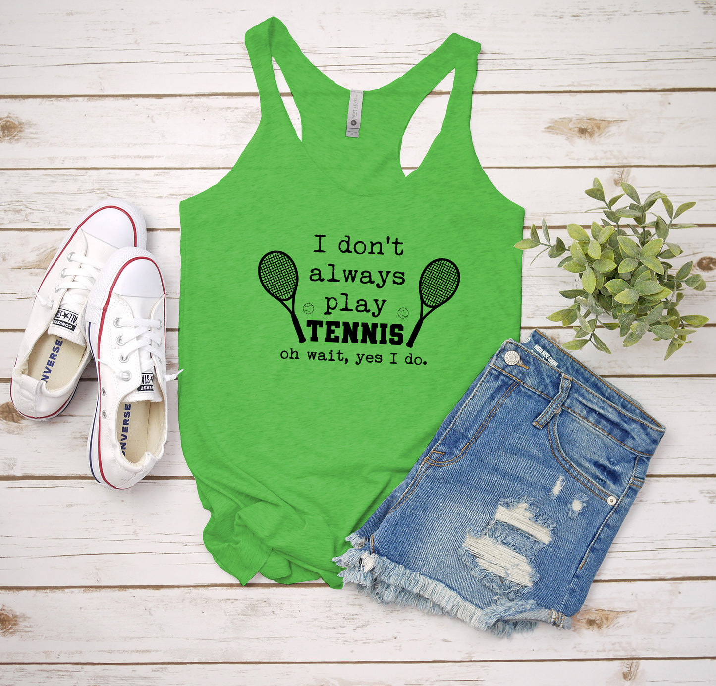 a green tank top that says i don't always play tennis