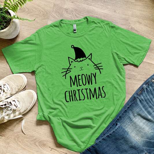 a green t - shirt that says meowy christmas next to a pair of