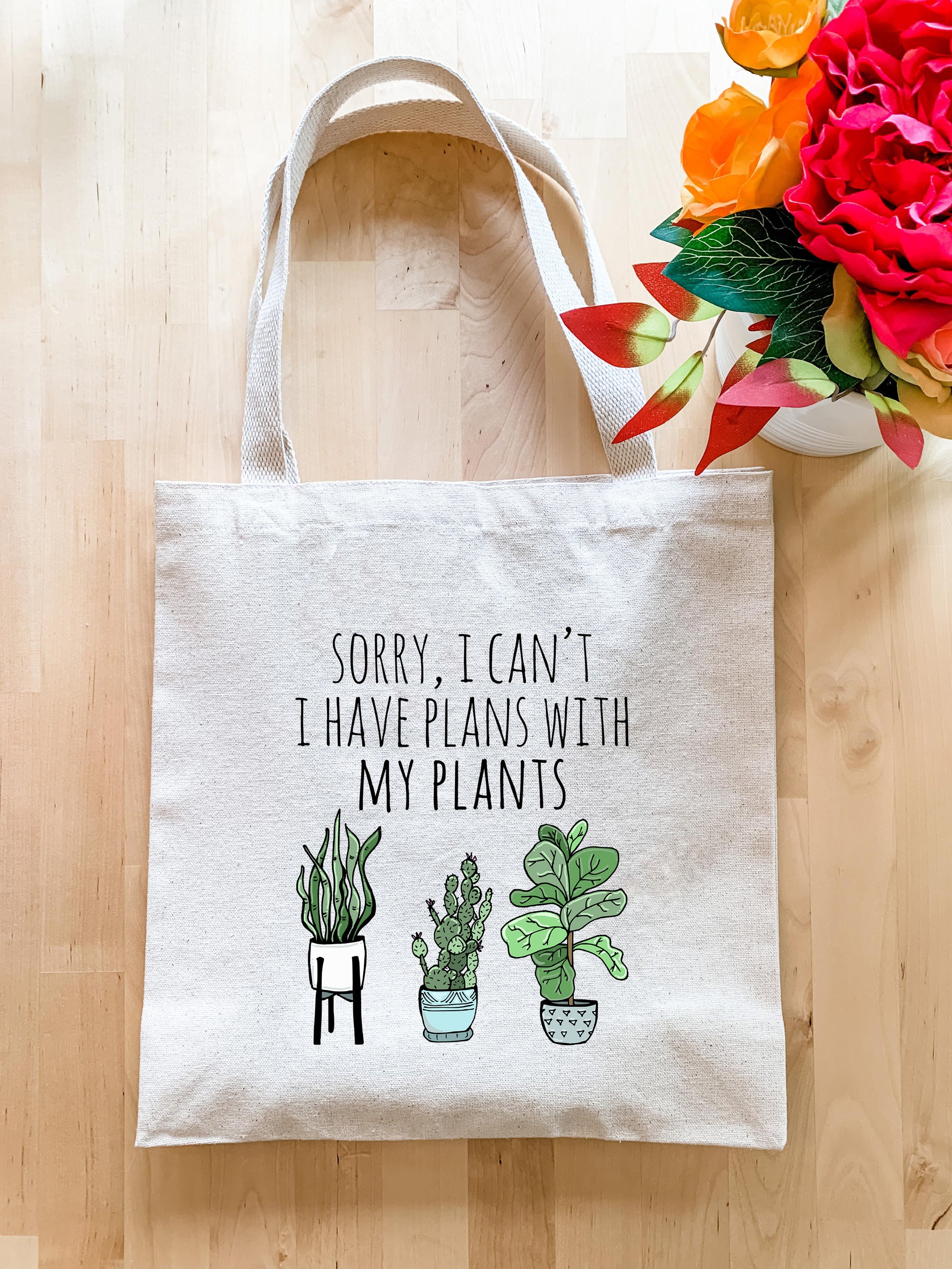 a tote bag that says sorry i can't have plans with my plants