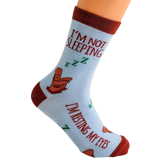 a pair of socks that say i'm not sleeping