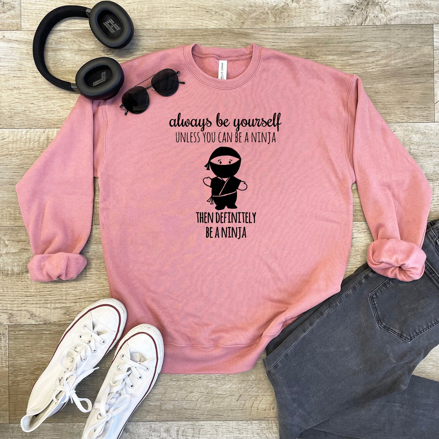 a pink sweatshirt with a picture of a monkey on it