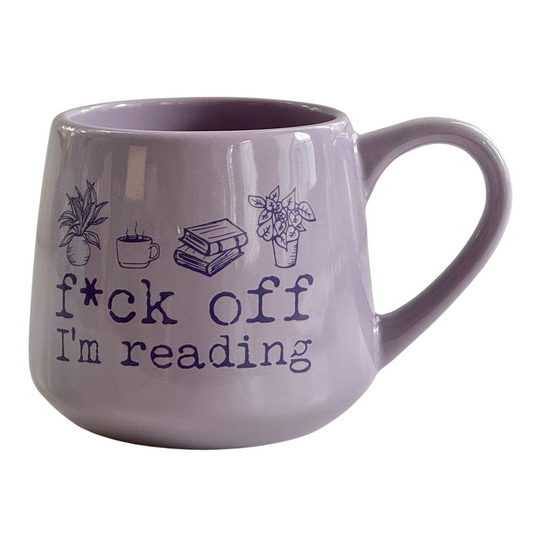 a purple coffee mug that says pick off i'm reading