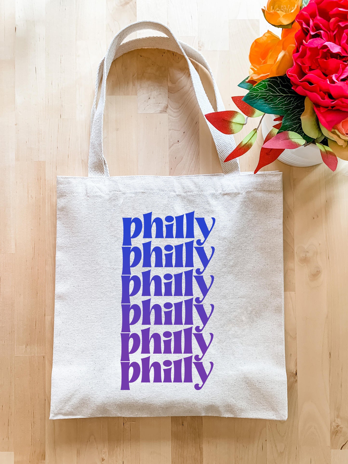 a tote bag sitting on top of a wooden floor