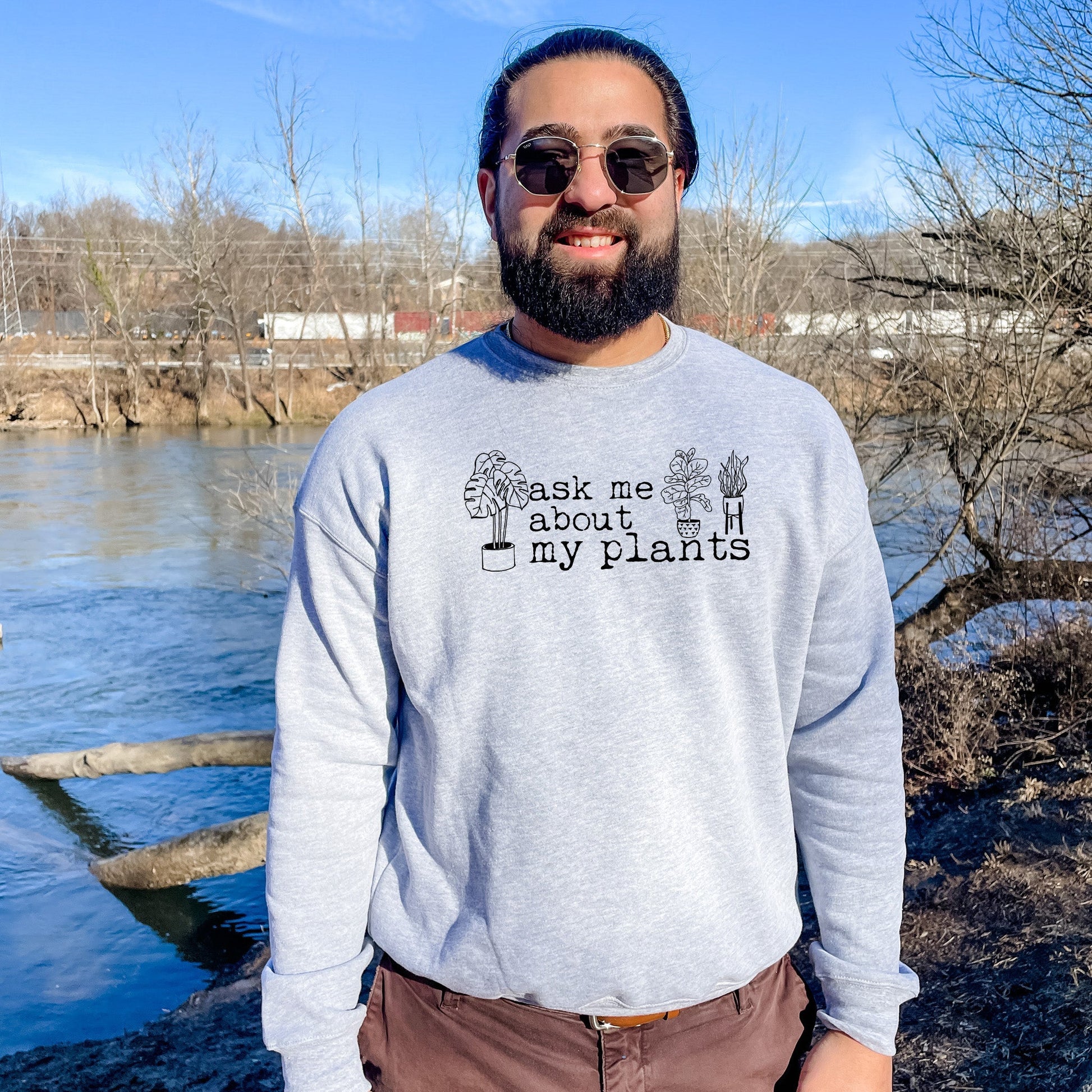 a man standing in front of a body of water