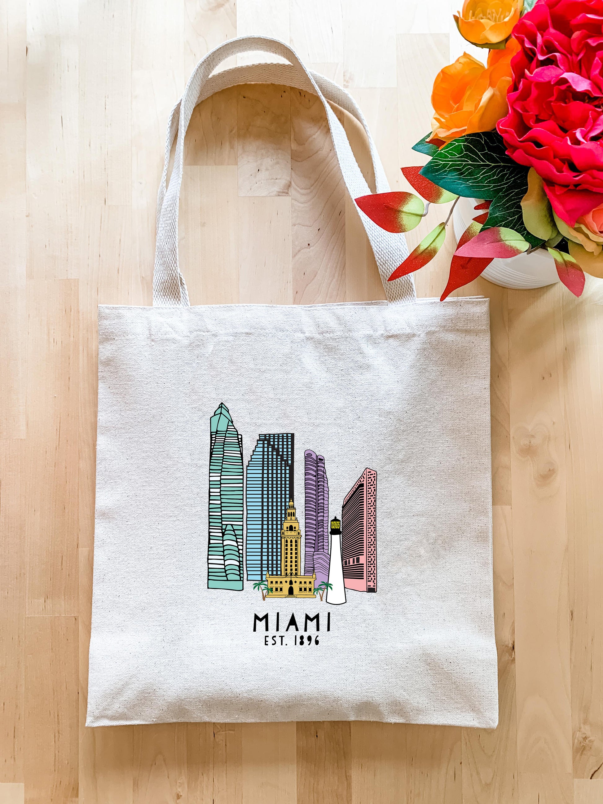 a white bag with a picture of a city on it