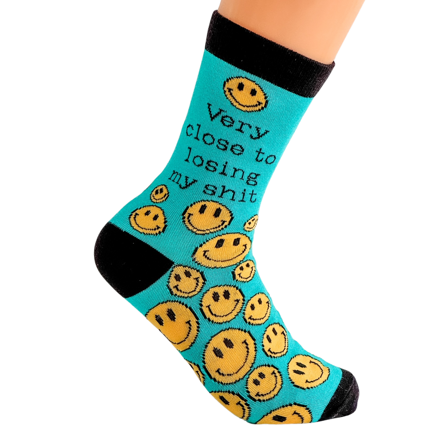 a pair of socks that say very close to losing my shit