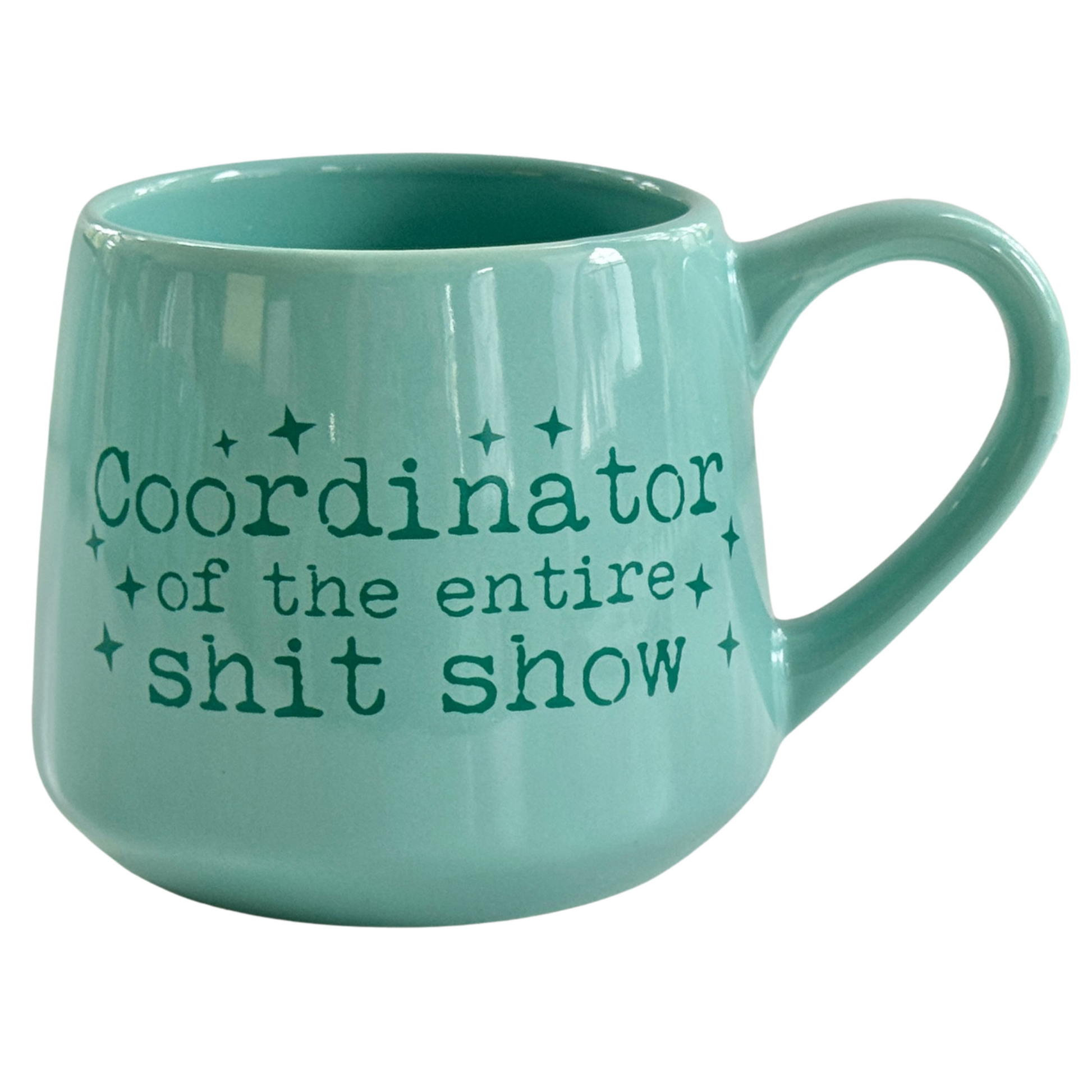 a green coffee mug with the words coordiator of the entire shit show