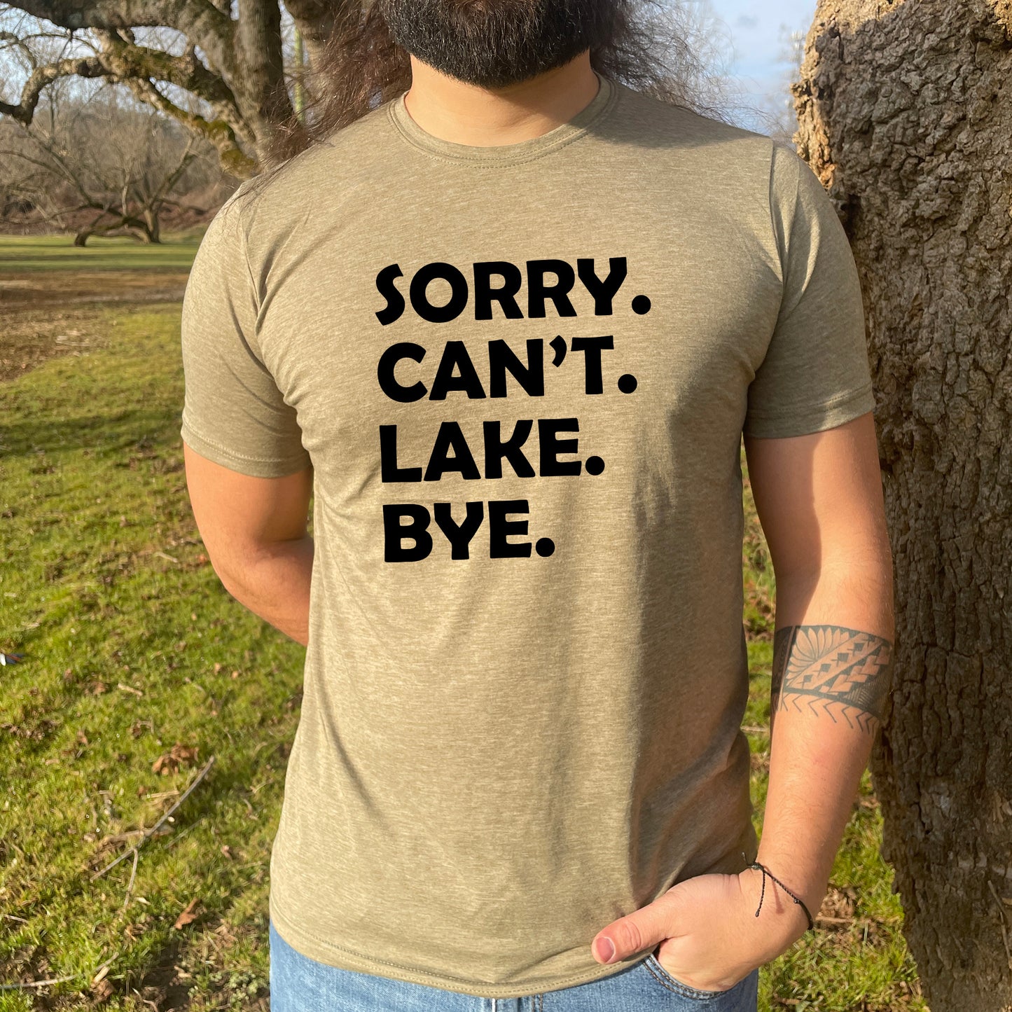 a man with a beard wearing a shirt that says sorry can't lake bye