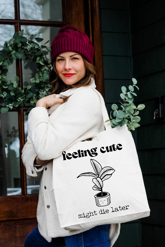 a woman holding a white bag with a plant in it
