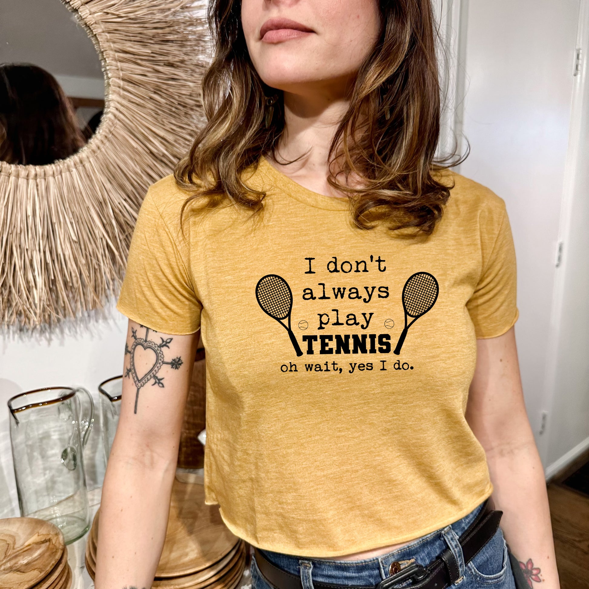 a woman wearing a t - shirt that says i don't always play tennis