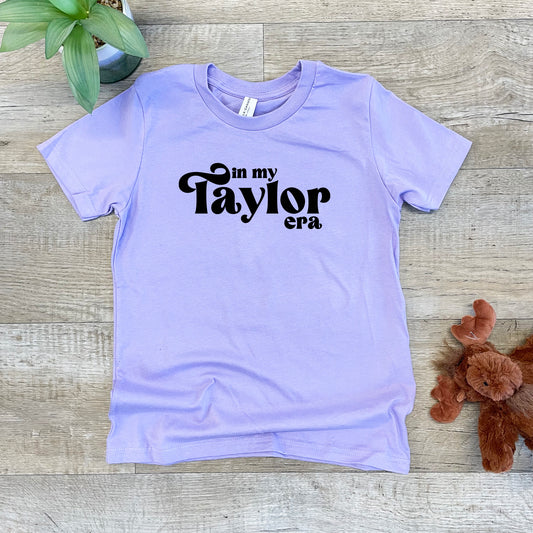 a t - shirt that says in my taylor crk on it next to a