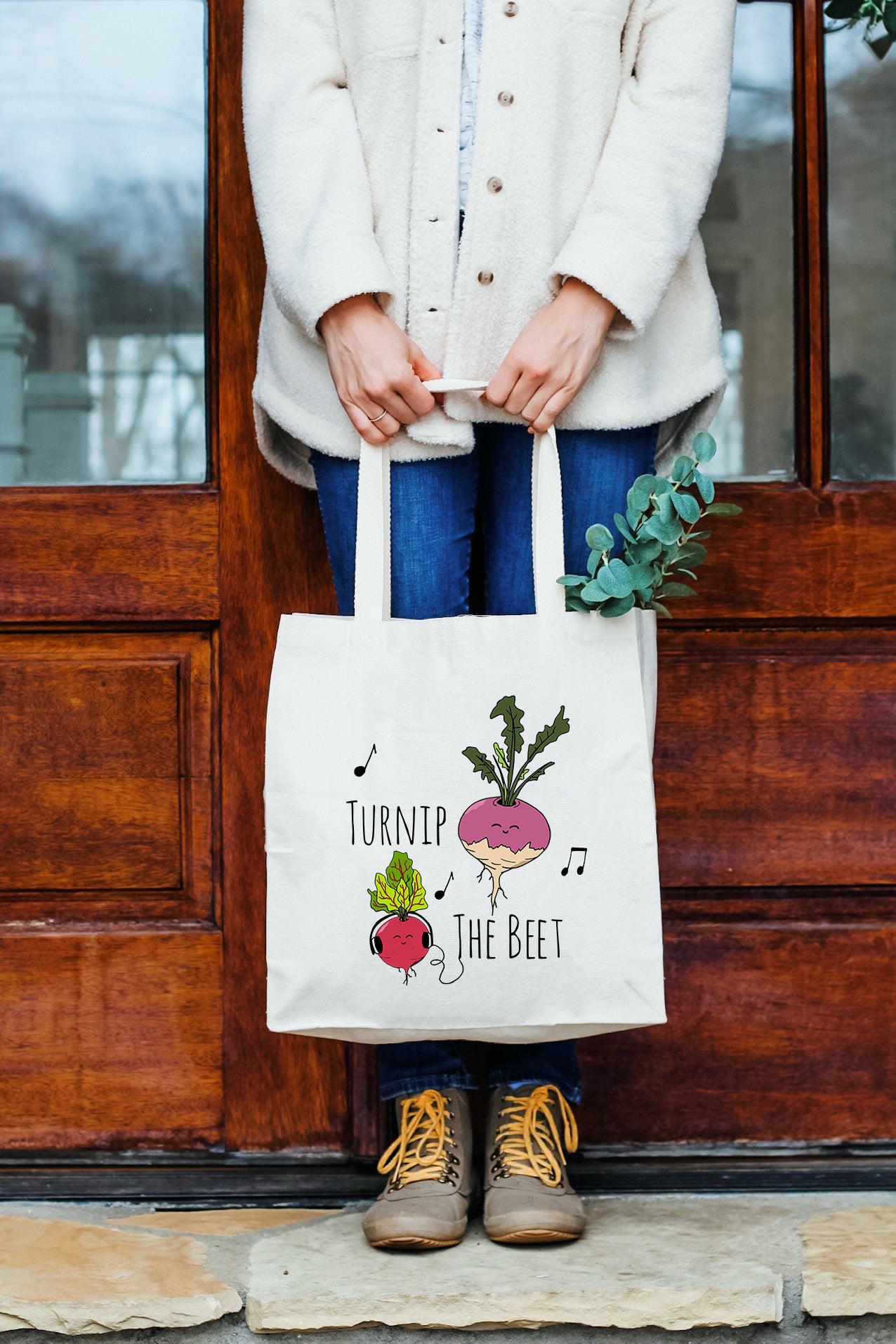 a woman holding a bag that says turnip the beet