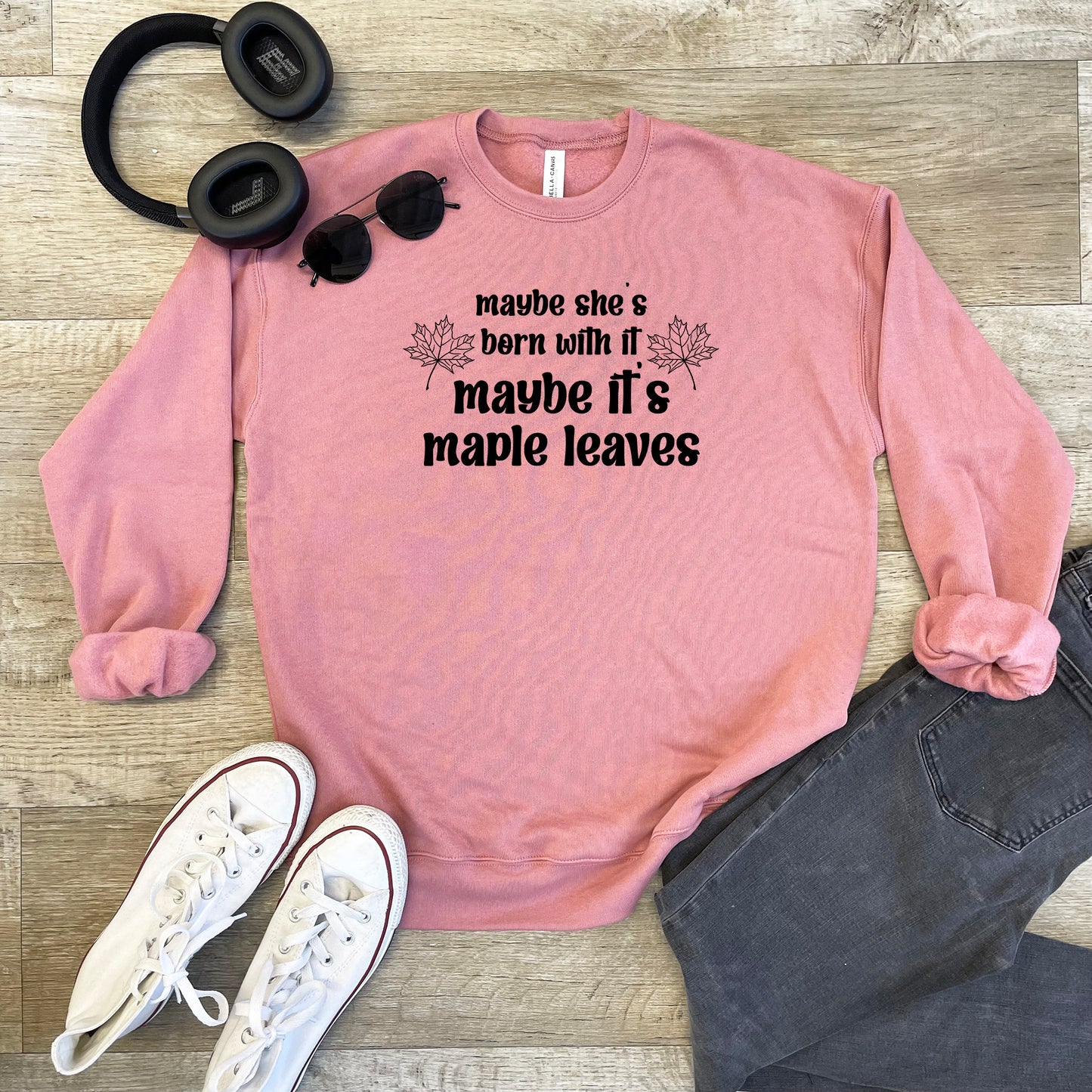 a pink sweatshirt that says maybe she's born with a maybe it's