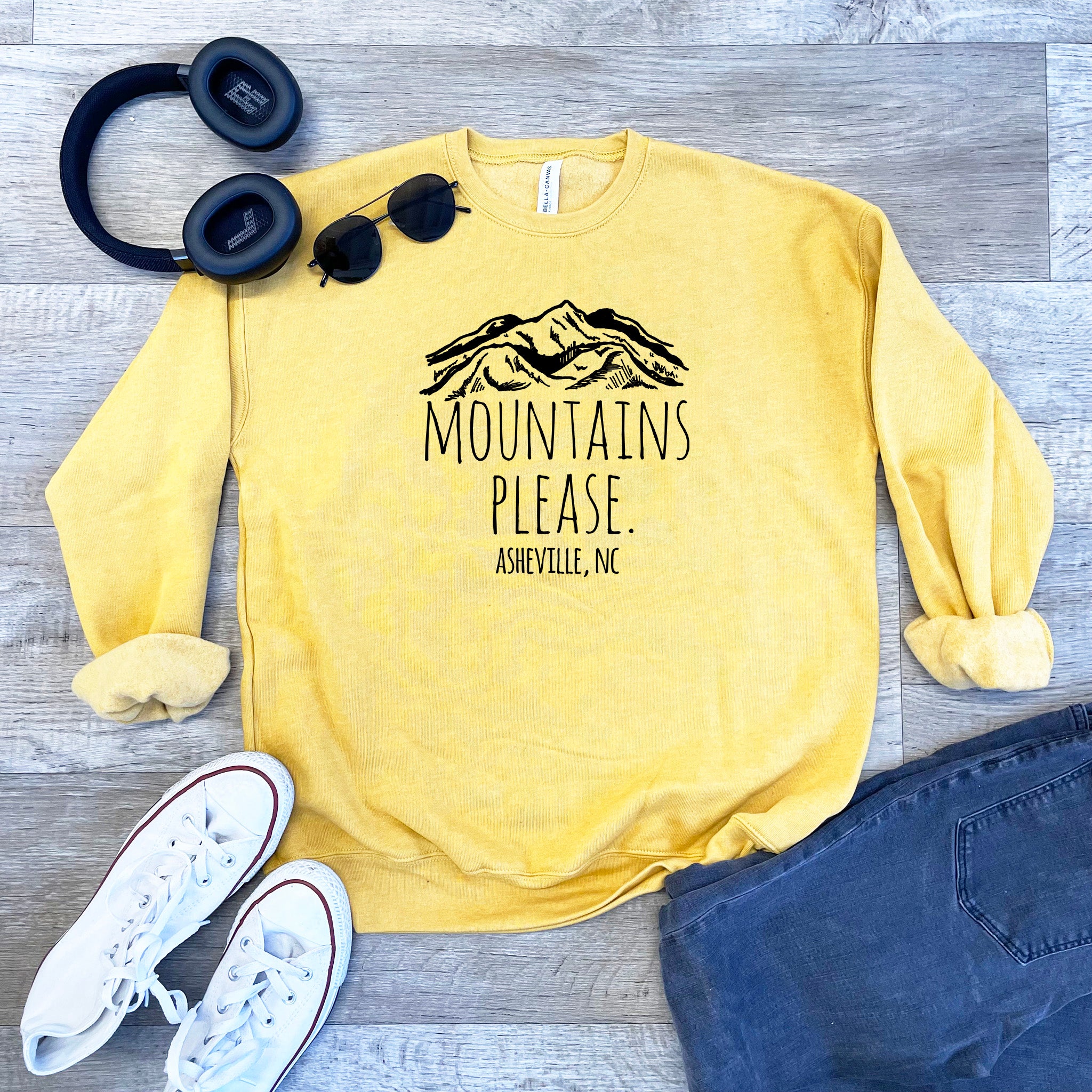 a yellow sweatshirt with the words mountains please on it