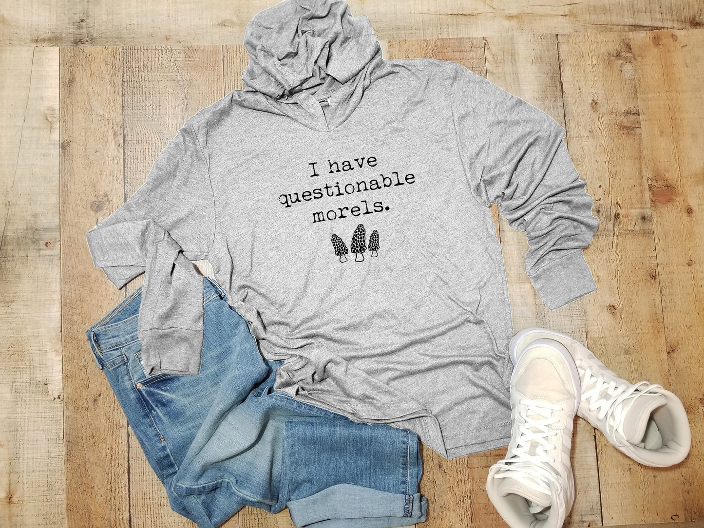 a grey hoodie with a pair of jeans and a pair of sneakers