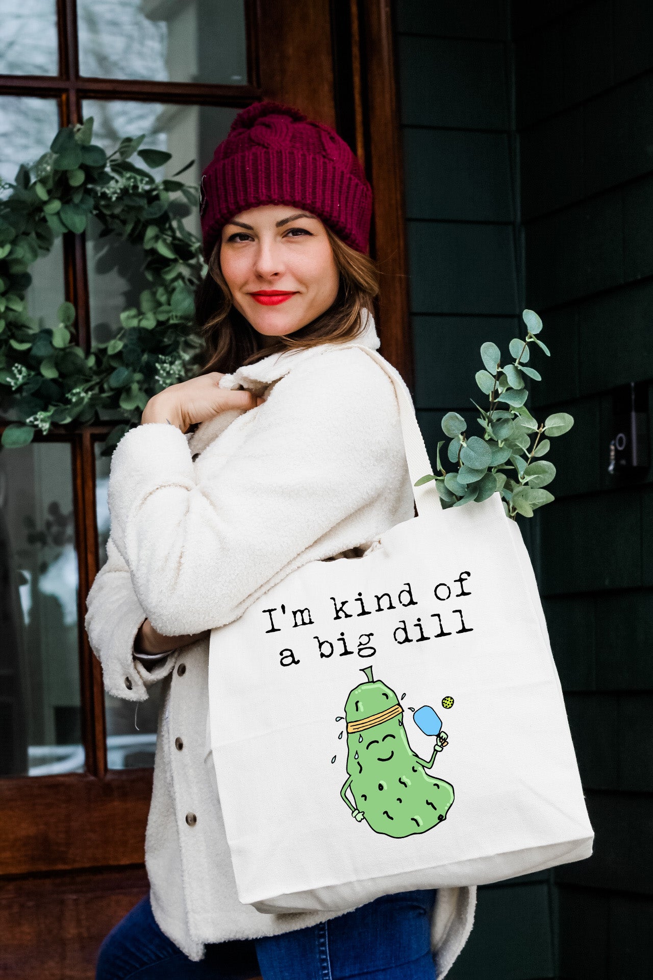 a woman carrying a bag that says i'm kind of a big dill