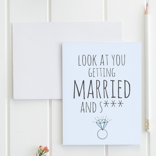 a card with a picture of a wedding ring on it